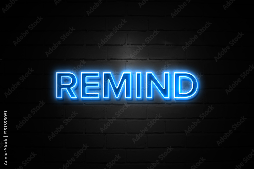 Remind neon Sign on brickwall