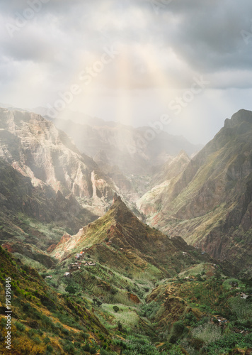 Mysterious sunrays shining on mountain peaks in Xo-Xo valley of Santa Antao island in Cape Verde