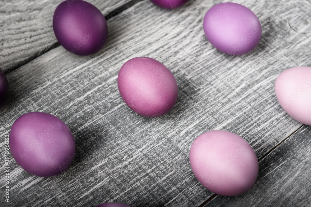 Easter eggs in fashionable colors on a gray wooden background Easter eggs in fashionable colors on a gray wooden background