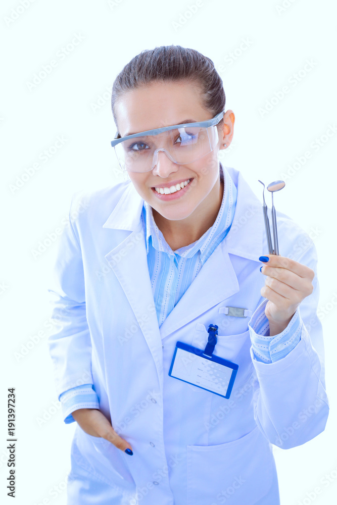 Beautiful female dentist doctor holding and showing a toothbrush isolated on a white background. Dentist doctor Beautiful female dentist doctor holding and showing a toothbrush isolated on a white background. Dentist doctor