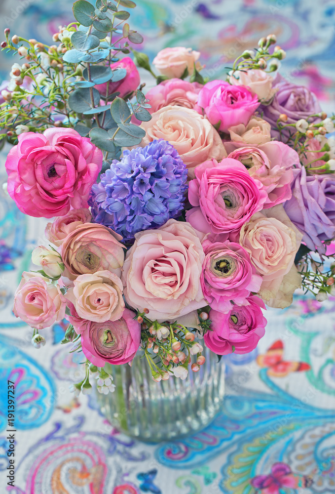 Beautiful bouquet of spring flowers in a vase on the table. Lovely bunch of flowers . Beautiful bouquet of spring flowers in a vase on the table. Lovely bunch of flowers .