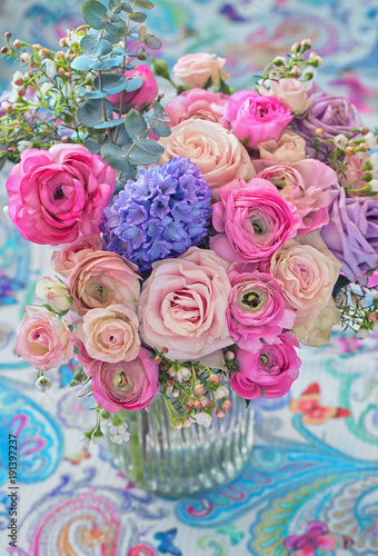 Beautiful bouquet of spring flowers in a vase on the table. Lovely bunch of flowers . 