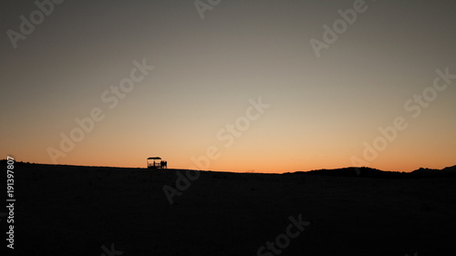 Silhouette of a mountain landscape in the snow with people © VitoPoma