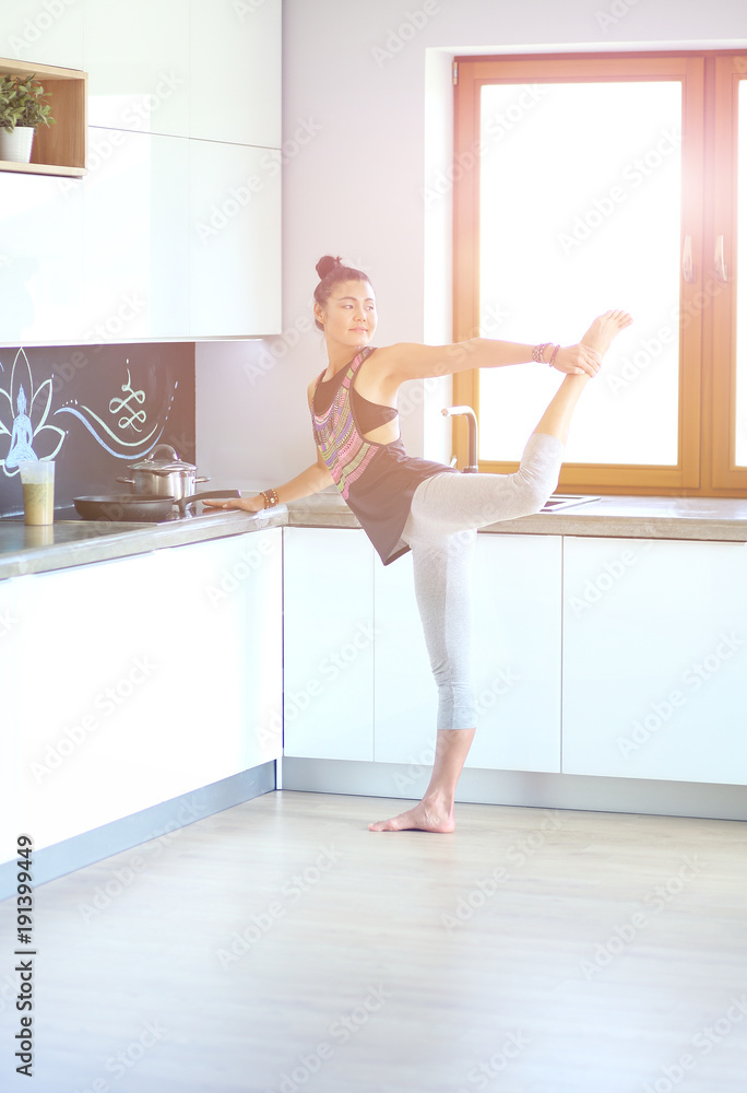 Fitness girl cooking healthy food in the kitchen. Woman. Kitchen. Cooking Fitness girl cooking healthy food in the kitchen. Woman. Kitchen. Cooking