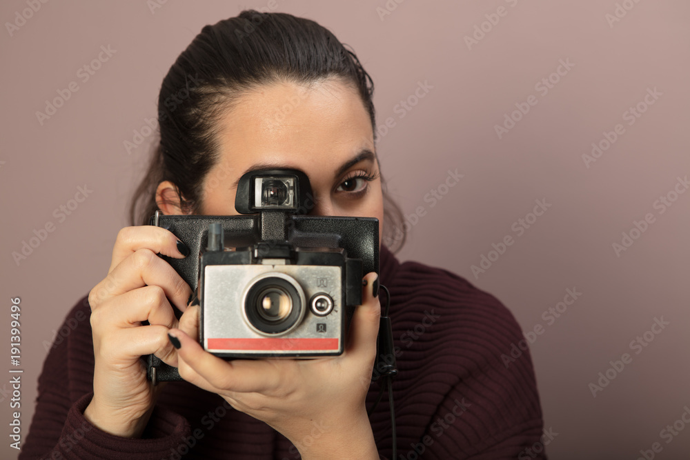 Young woman focusing on the viewer Young woman focusing on the viewer