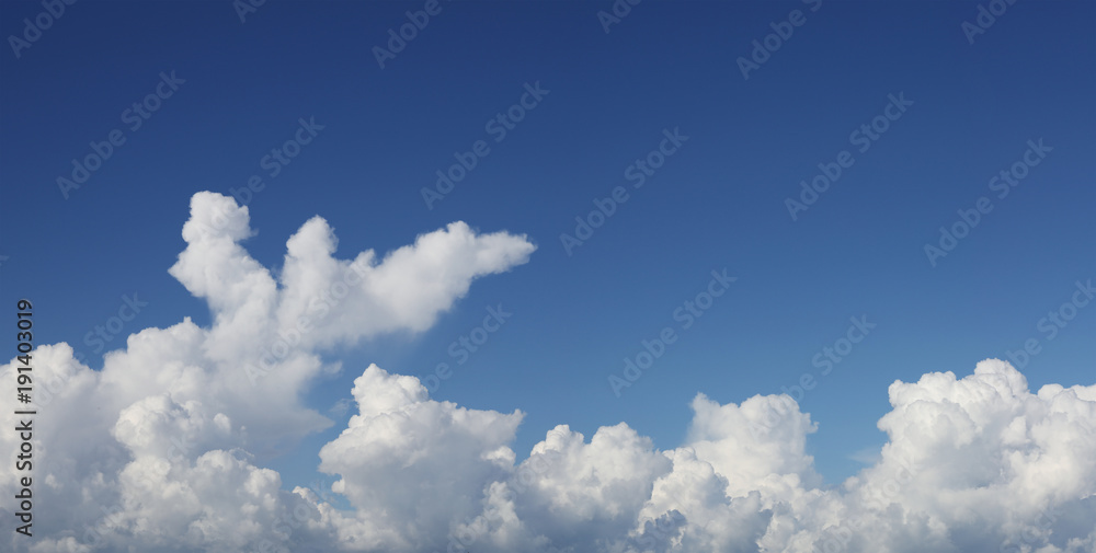 Fluffy white clouds in blue sky. Copy space Fluffy white clouds in blue sky. Copy space