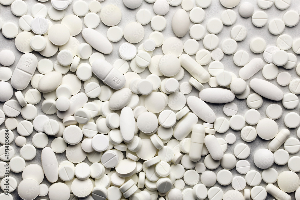A lot of white medicine pills A lot of white medicine pills