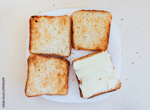 Four toasts on the white plate