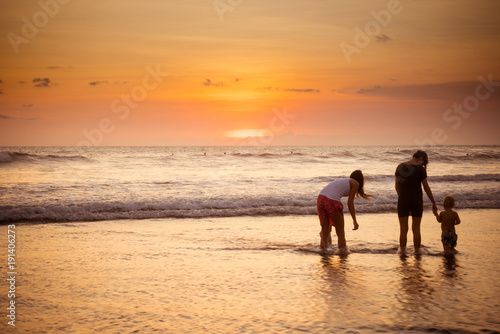 Beach with people in sunset