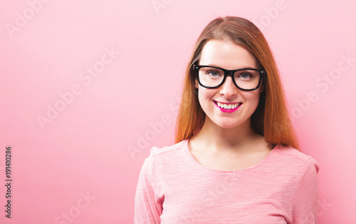 Happy young woman on a solid background