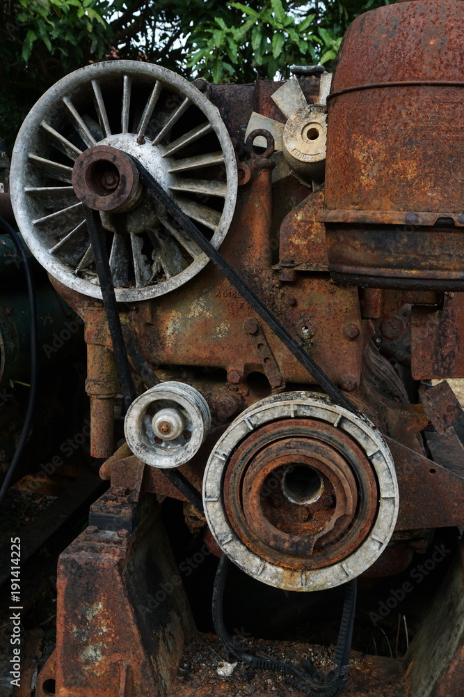Grain Image: Close up of old machine factory made of steel and used in the past. Broken and rustic machine left over in abandon factory. Image of aged equipment with rust and gear part. Grain Image: Close up of old machine factory made of steel and used in the past. Broken and rustic machine left over in abandon factory. Image of aged equipment with rust and gear part.
