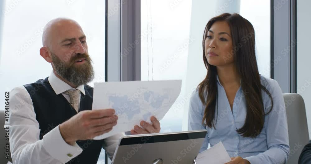 4k, businessman sharing an idea with colleagues at a meeting. Slow motion. 4k, businessman sharing an idea with colleagues at a meeting. Slow motion.