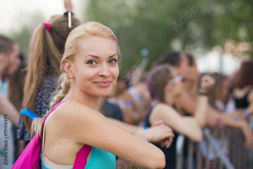 cheerful girl at the concert