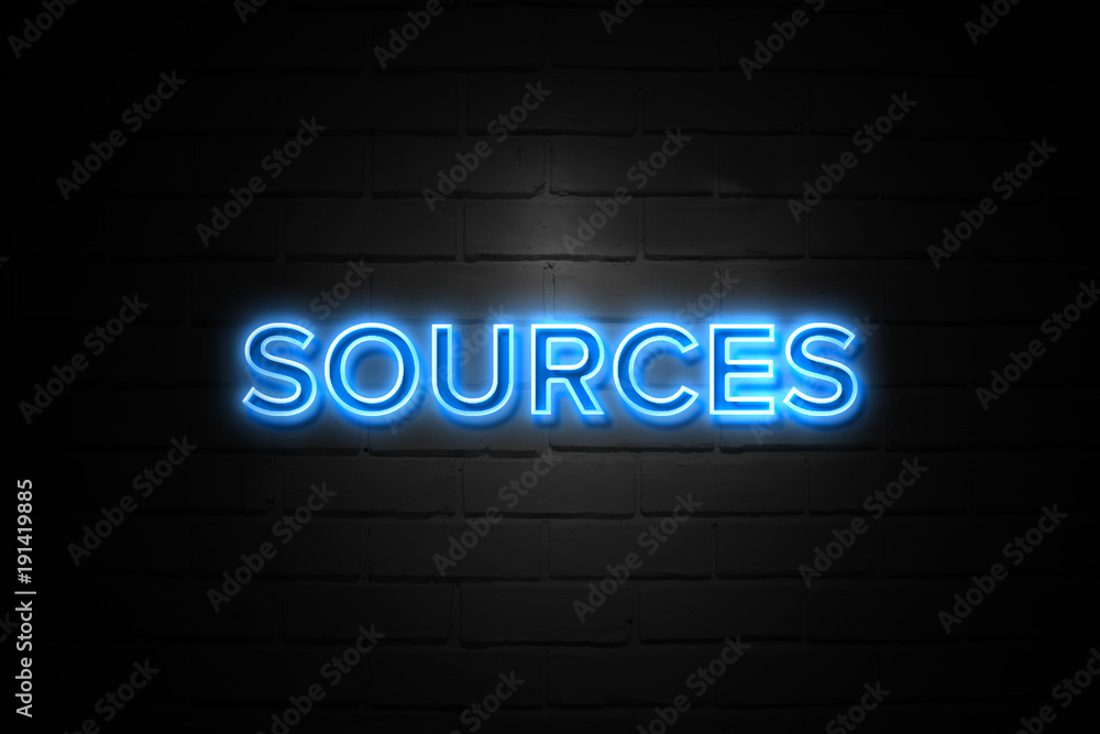 Sources neon Sign on brickwall Sources neon Sign on brickwall