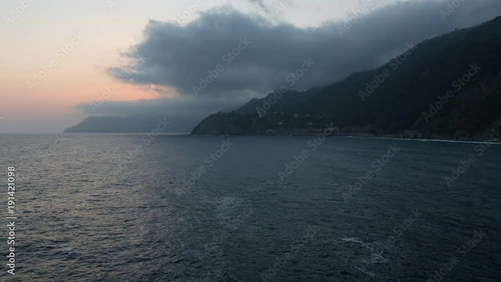 Beautiful late evening twilight summer view from Manarola (one of five famous villages of Cinque Terre National Park in Liguria, Italy) stony coast to Corniglia and Cinque Terre rocky shore in far.
Beautiful late evening twilight summer view from Manarola (one of five famous villages of Cinque Terre National Park in Liguria, Italy) stony coast to Corniglia and Cinque Terre rocky shore in far.