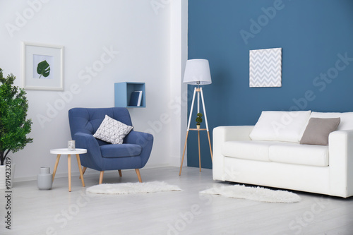 Trendy room interior with modern color armchair