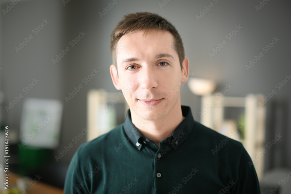 Portrait of young man in casual clothes indoors Portrait of young man in casual clothes indoors