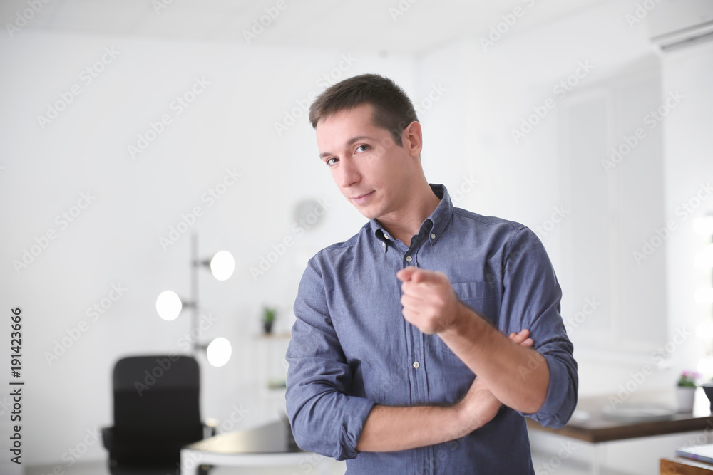 Naklejka premium Portrait of young man in casual clothes indoors