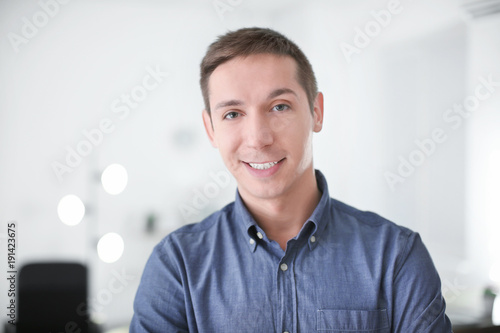 Portrait of young man in ca...