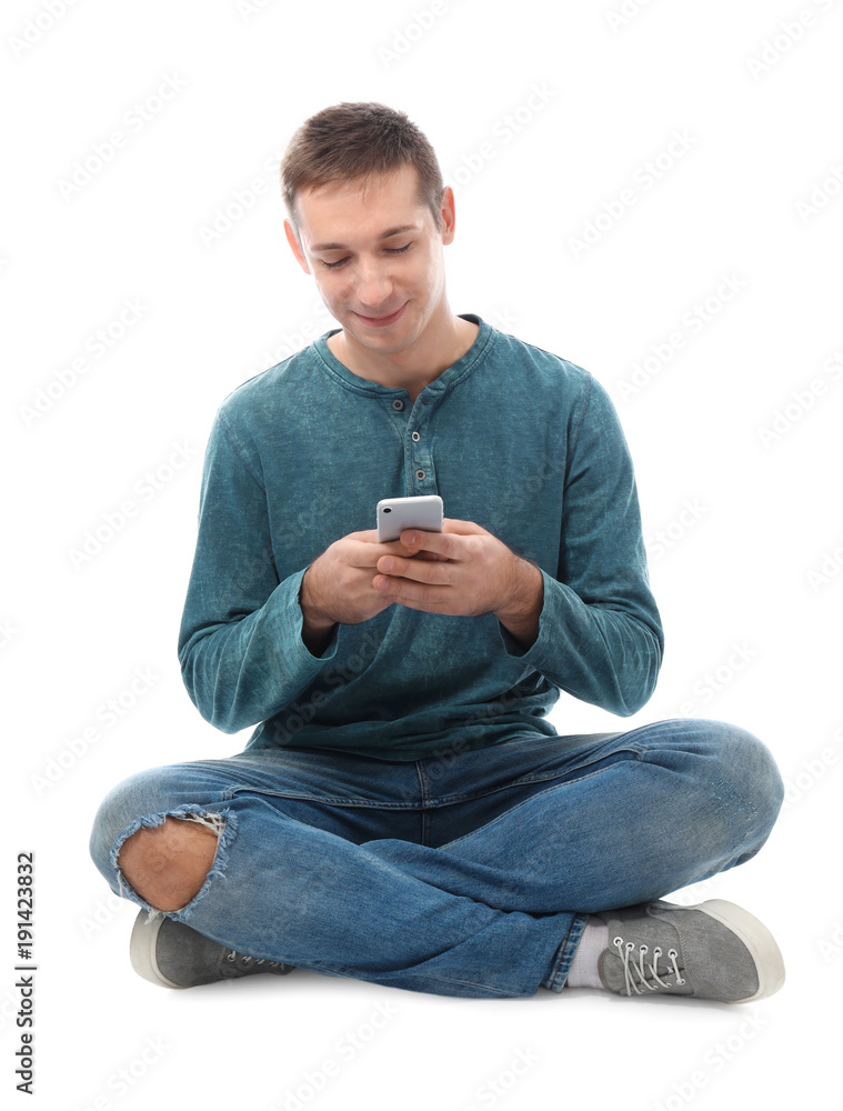 Attractive young man with mobile phone on white background Attractive young man with mobile phone on white background