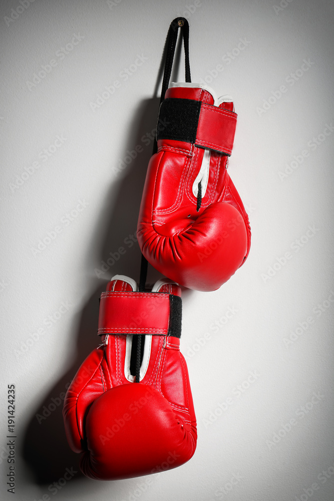 Boxing gloves on light background
