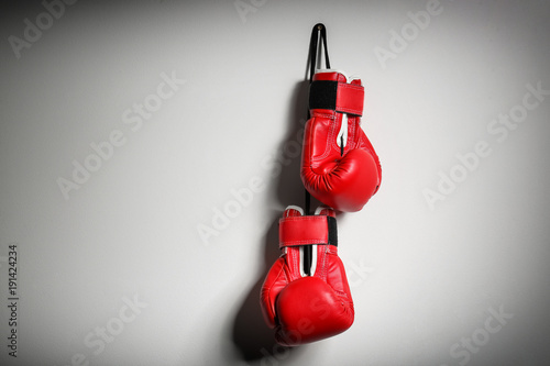 Boxing gloves on light background © Africa Studio