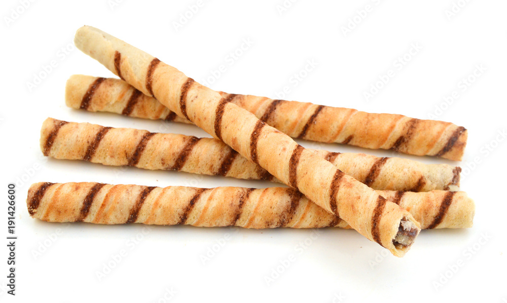 Heap of striped wafer tubules with the chocolate cream, isolated Heap of striped wafer tubules with the chocolate cream, isolated