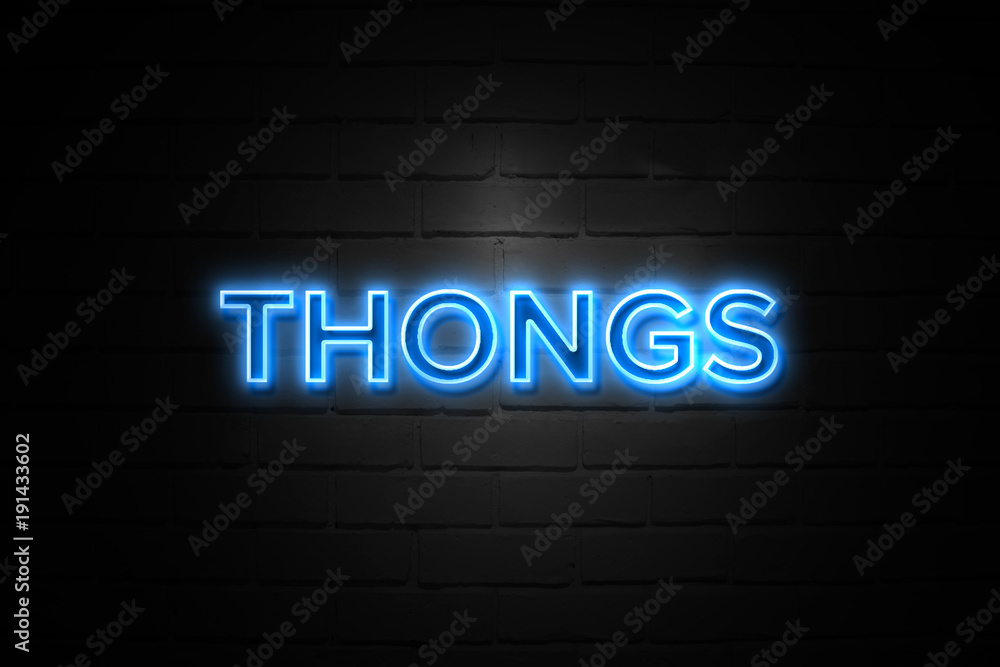 Thongs neon Sign on brickwall