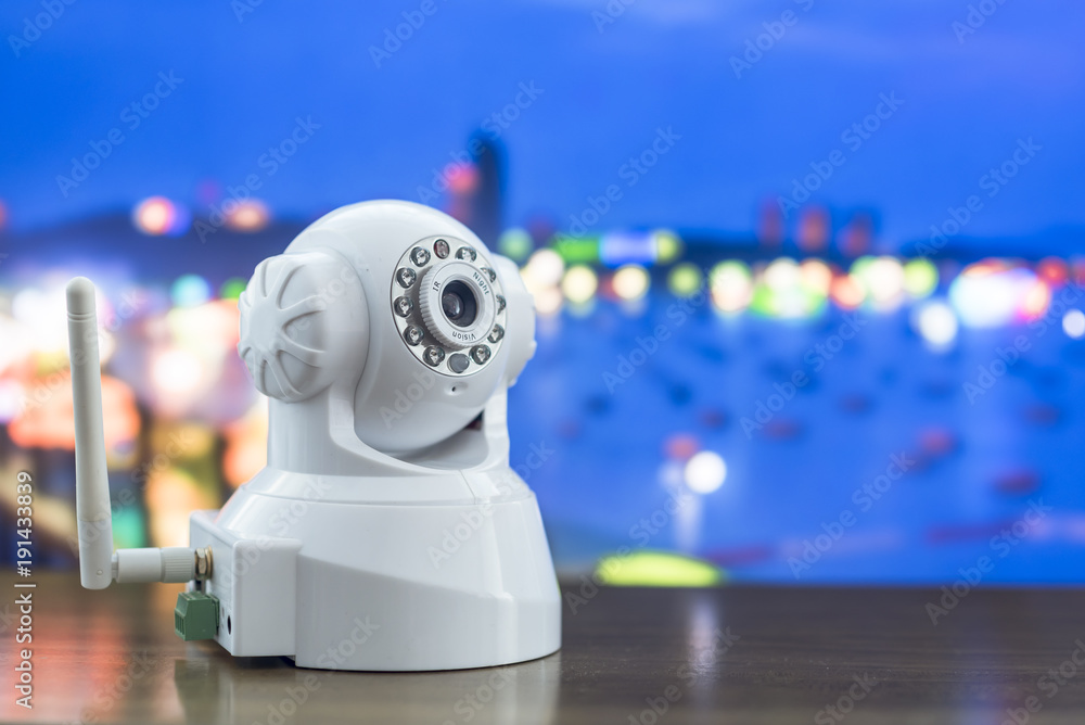 A Robot CCTV camera system put on table with blur background A Robot CCTV camera system put on table with blur background