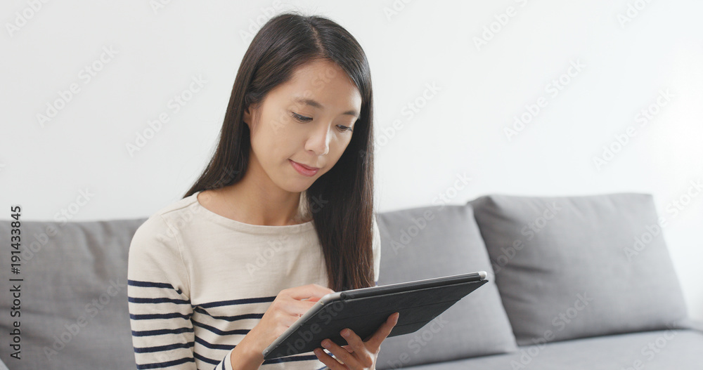Woman using tablet computer for online shopping Woman using tablet computer for online shopping