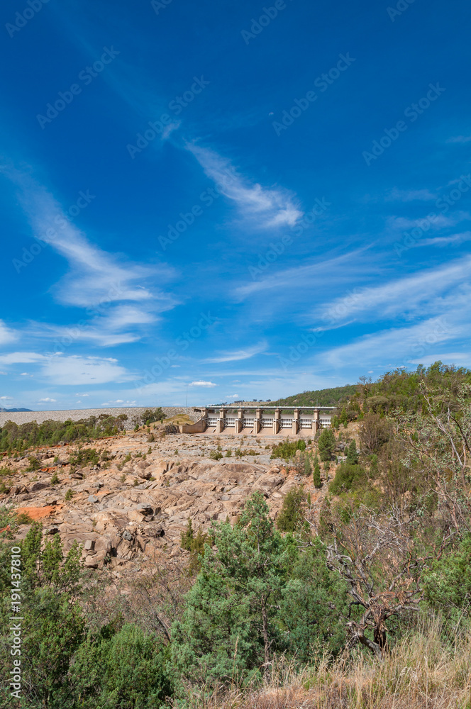 Countryside landscape with dam wall in the distance