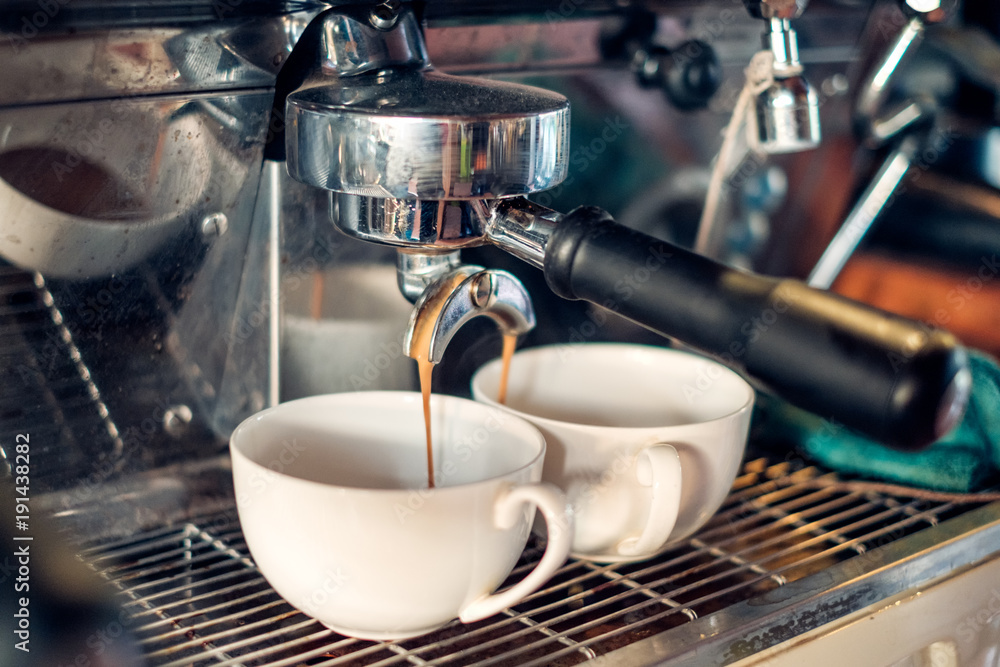 Coffee Maker making coffee flowing in cup Coffee Maker making coffee flowing in cup