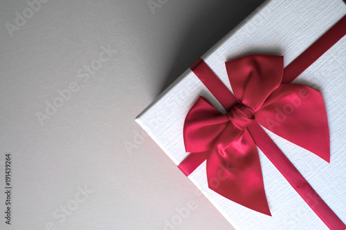  Valentine present. Gift box and red ribbon for romantic couple.
