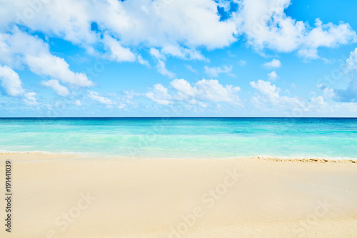 Clear aqua blue sea water and white sand tropical beach © LR Photographies