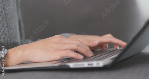 Typing on laptop computer
