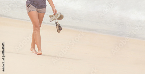 woman walking on sand beach. Closeup. legs.