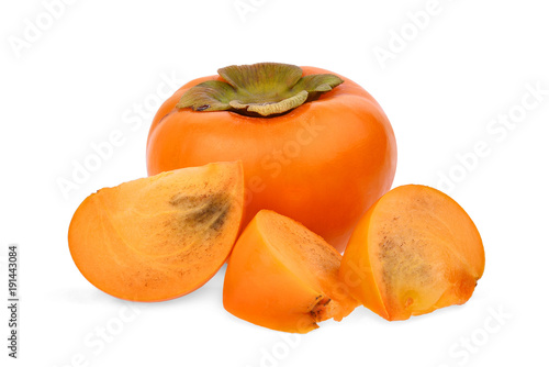 whole and slices of fresh ripe persimmons isolated on white background