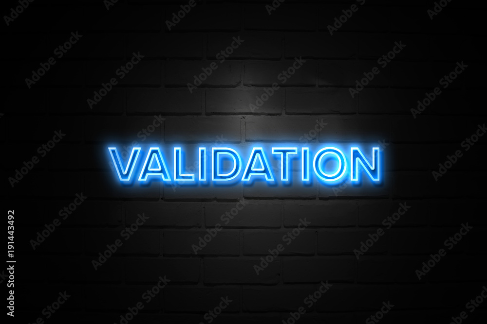 Validation neon Sign on brickwall Validation neon Sign on brickwall
