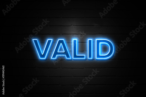 Valid neon Sign on brickwall