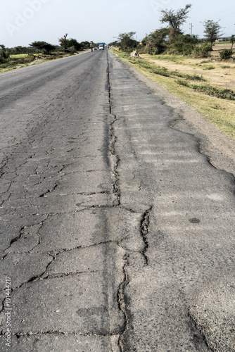 Damaged asphalt road with potholes,perspective in Addis Ababa, Ethiopia