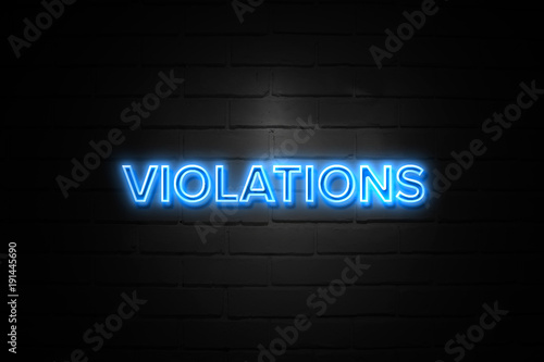 Violations neon Sign on brickwall