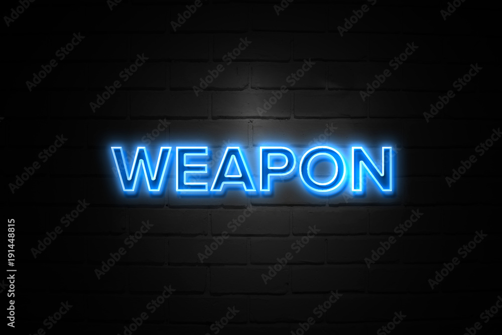 Weapon neon Sign on brickwall