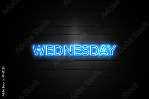 Valokuva Wednesday neon Sign on brickwall