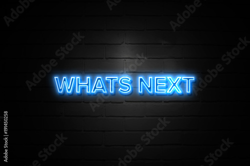 Whats Next neon Sign on brickwall photo
