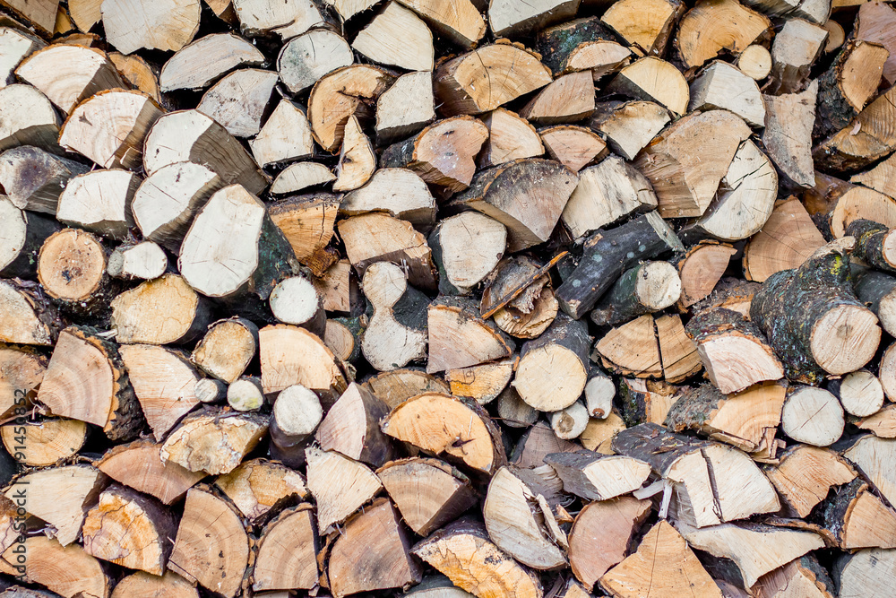 neatly stacked firewood, fuel in the cold winter, a pattern for creativity_ neatly stacked firewood, fuel in the cold winter, a pattern for creativity_