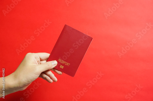 no name Passport　パスポートを提出する　国名なしのパスポート　赤色背景 photo