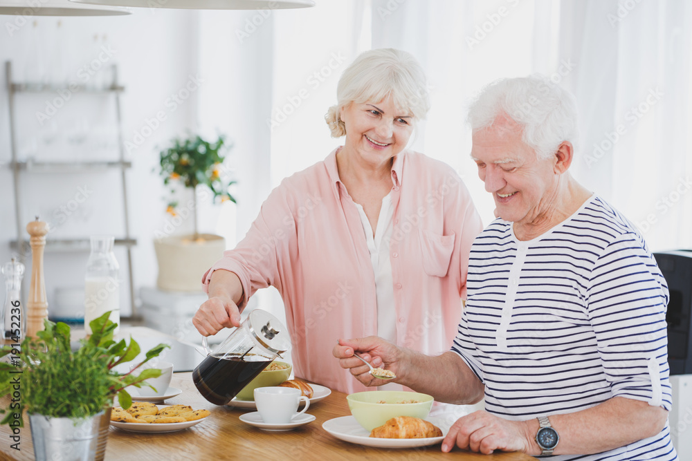 Elderly man eating corn flakes Elderly man eating corn flakes