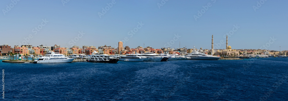 SHARM EL SHEIKH, EGYPT - JUNE 8, 2017: east dock blue sea and big luxury yachts panorama. Editorial photo