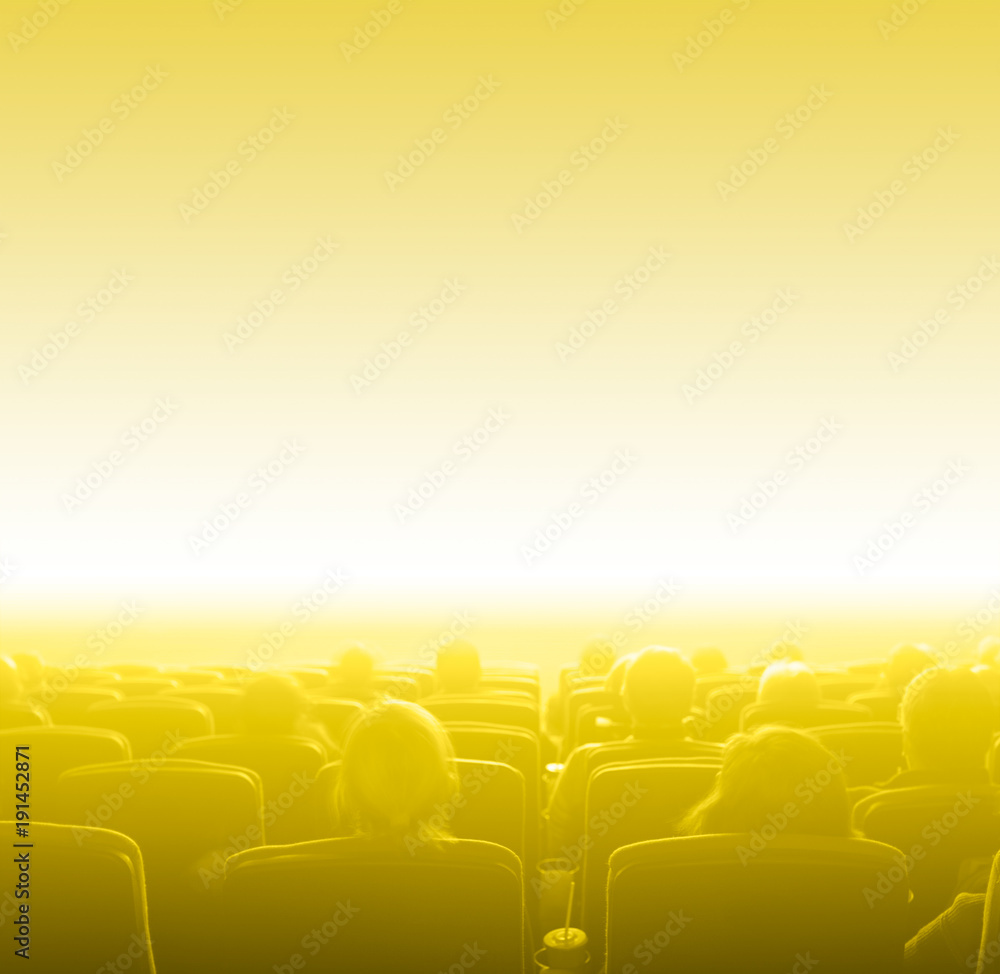 Obraz premium viewers at movie theater, yellow toning copy space