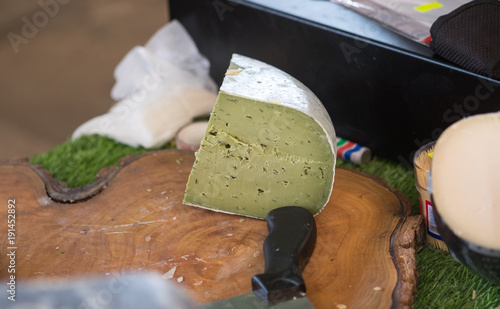 Pesto green cheese sold for sale at farmers market